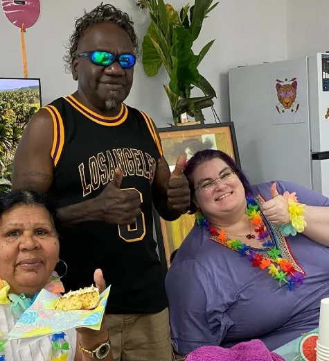 Compassionate Community Care participants and support worker celebrating together
